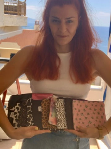 areti holds clunch bags